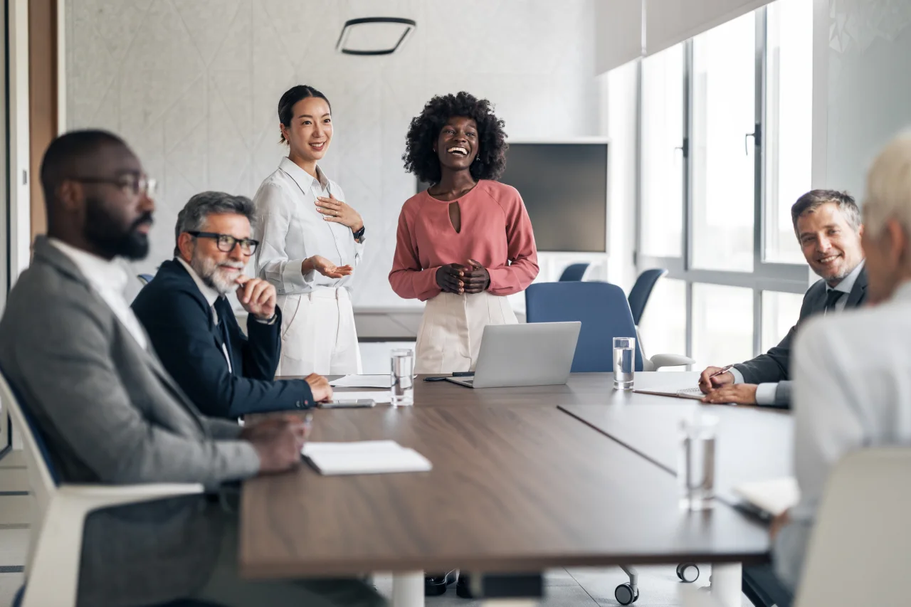 People collaborating around a meeting table