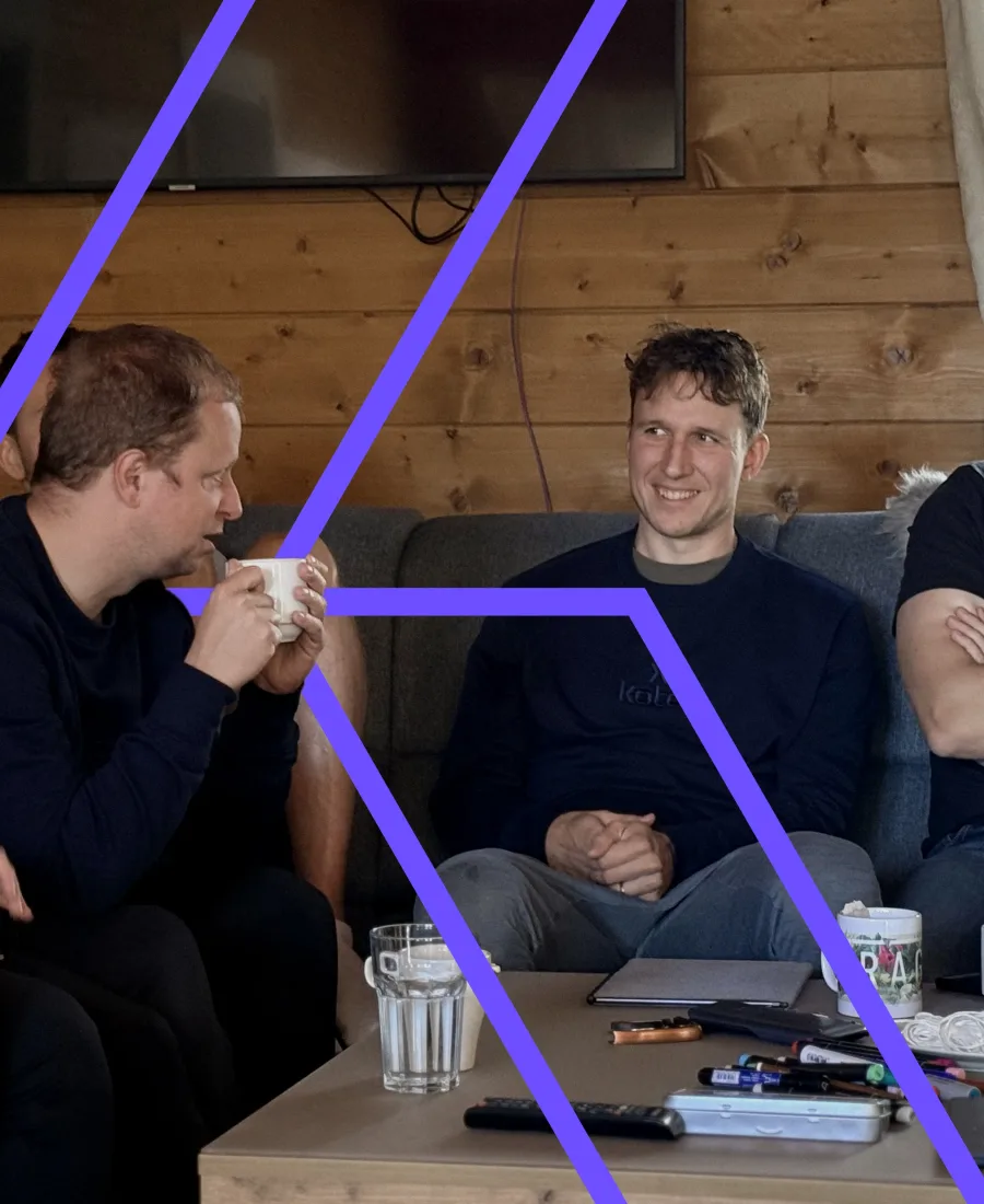 Koton team members talking over coffee
